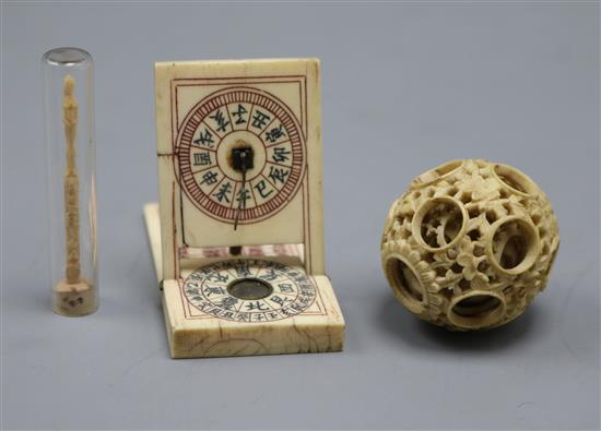 A Chinese ivory zodiac compass, a puzzle ball and a 19th century carved matchstick